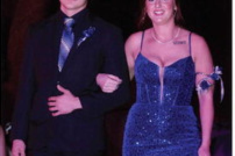 Student Body President Ashley Tolsma escorted by Jackson Kaul
