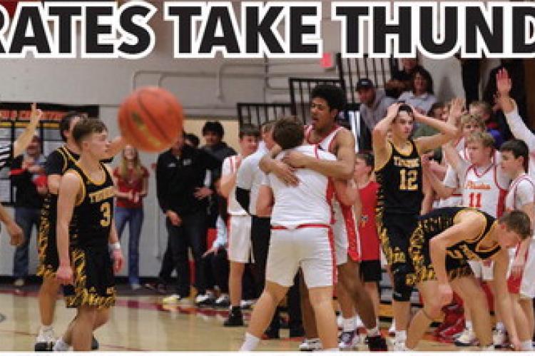 (Photo above) Al'Shamon Gunter hugs Dominic Doom for his last shot attempt (photo below) which led the Pirates into overtime. Photos by Barb Pechous