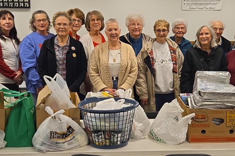 Auxiliary members in attendance with the food pantry donation are pictured back row, from left: Pam Bastemeyer, Kathy Zolnowsky, Dolores Kotab, Barb Wiechmann, Agnes Nedved, Rita Krcil, Eleanor Andersh, Sandy Seiner, and Jeanette Fuchs; front, from left: 