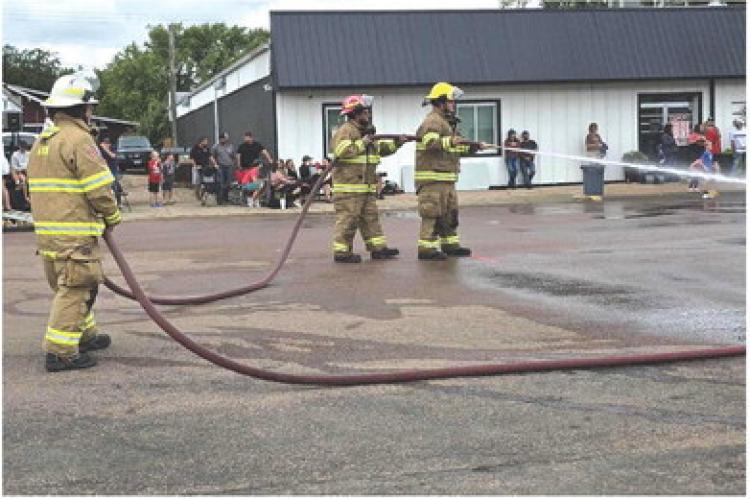 COMMUNITY FATHER-SON AVON FIREFIGHTER TEAM WINS LABOR DAY WATERFIGHT