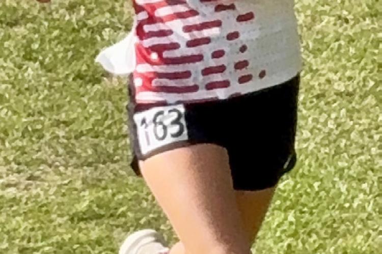 Taya Stone takes 18th in the Varsity 5k.