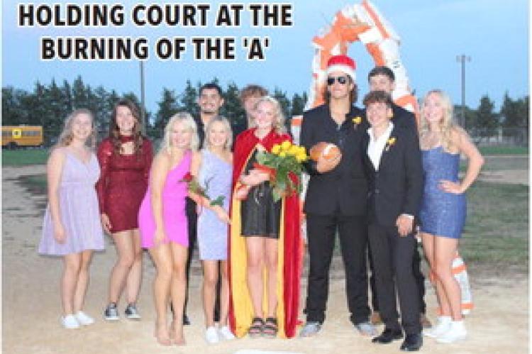 HOLDING COURT AT THE BURNING OF THE 'A'
