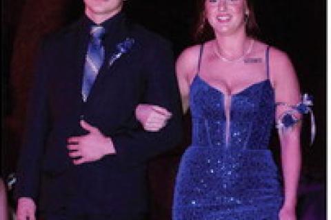 Student Body President Ashley Tolsma escorted by Jackson Kaul