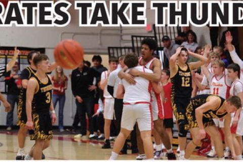 (Photo above) Al'Shamon Gunter hugs Dominic Doom for his last shot attempt (photo below) which led the Pirates into overtime. Photos by Barb Pechous