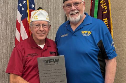 Post 7319 Quartermaster, Jerry Seiner, left received a “White Hat” from Dr. James Tuorila, National VFW Surgeon General.