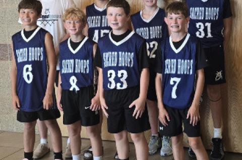 12U Sacred Hoops players pictured are back row, from left: Coach Trevin Price (Mount Marty University basketball player), Noah Kampshoff, Mason Tjeerdsma (Wagner), Houston Paxton. Front, from left: Clayton Hiles, Brody Thompson, Dawson Peters (Wagner), Tu