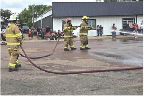 COMMUNITY FATHER-SON AVON FIREFIGHTER TEAM WINS LABOR DAY WATERFIGHT