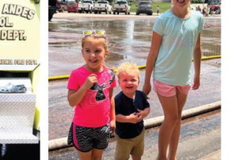 Huntlie Petrik, Blaze Petrik and Oaklie Petrik play in the water cheering on their dads in the water fights!