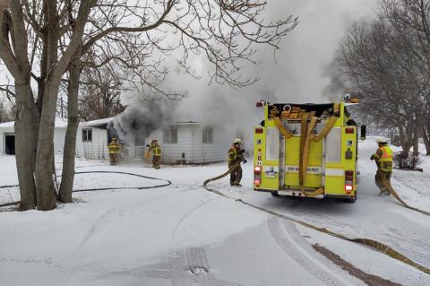 FIREMEN BRAVE THE COLD TO FIGHT MOTEL FIRE