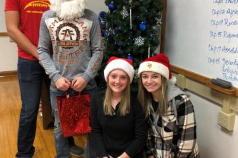 CHEERLEADERS SPREAD CHRISTMAS CHEER WITH CANDY GRAMS