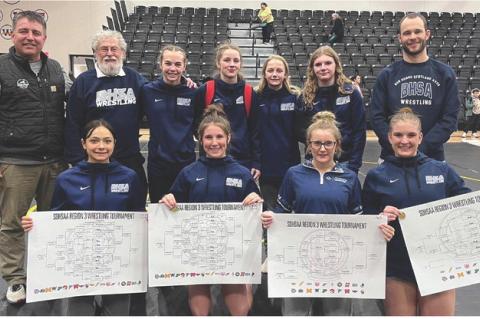 Girls Wrestling team members are, back row from left: Asst. Coach Ben Hellmann, Asst. Coach Jim Kocer, Sydney Johnson, Britney Rueb, Tatum Palsma, Bailey Hemnitz, and Asst. Coach Wes Kloucek; front row: Jasmine Ruelas-Hertz, Harper Kracht, Hadlee Kracht, 