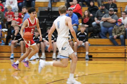 Jesse Zephier bringing the ball down the court.
