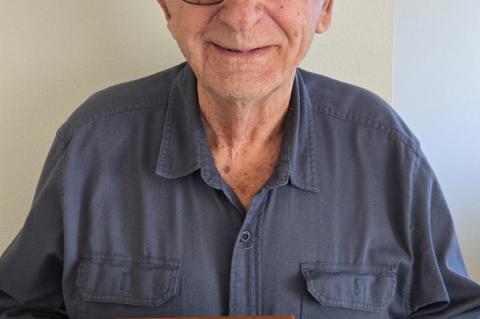 Doyle Reinschmidt with his 50-year membership plaque.