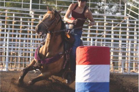LOCAL RIDERS COMPETE I N BARREL RACING EVENT