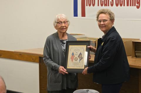 Mayme Crisman receiving her award for 70 continuous years of membership presented by Membership Chairman Barbara Kucera.