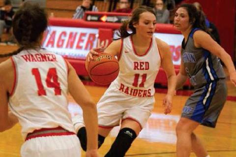 #11 Macy Koupal drives in as #14 Eve Zephier looks to assist  . Photos by Barb Pechous