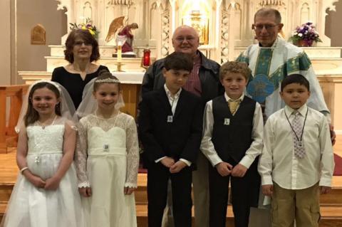 FIRST COMMUNION AT ST. JOHNS BAPTIST CATHOLIC CHURCH
