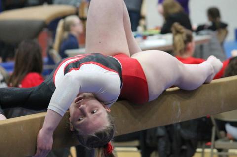 Faithleigh Podzimek on the beam .