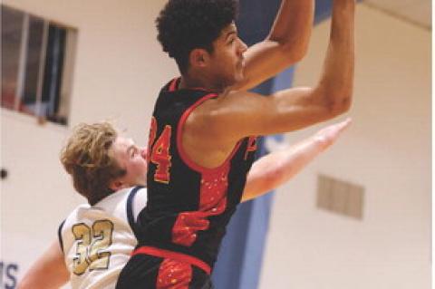 Al'Shamon Gunter, the 'Rebound King' of the night, with one of his 11 rebounds of the night at Gayville. Photos by Barb Pechous