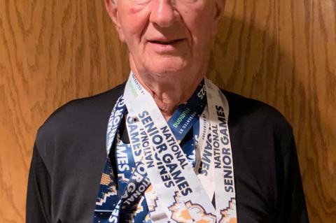 Howard Bich pictured with his 5 National Senior Games Medals - 2Gold And 3 Silver.