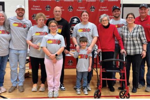Family members present for the Coach Poppe's reception February 3rd were, back row, from left: Carole Foster, Nick Poppe, Shelly Poppe, Coach Poppe, Megan Heyden, Margaret Poppe, Brand Heyden, Brenda Fathke, and Mel Fathke; front row: Havorly Heyden, and 