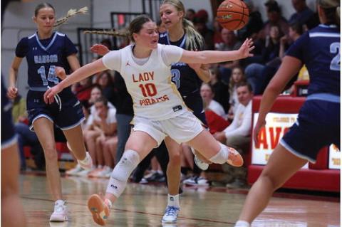 Rilyn Thury works to deflflect a pass on the defensive end. Photos by Barb Pechous