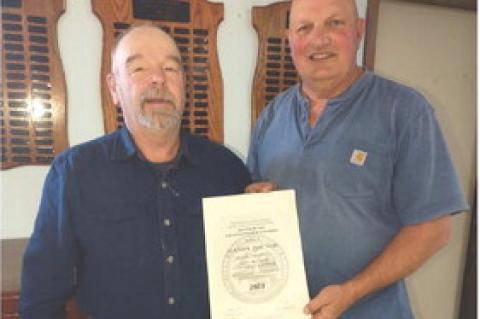 Treasurer Nolan Johnson presents the Judge John W Tobin Chapter Volunteer Award to Randy Milne. Randy has been the President for the Bon Homme County IWLAChapterfor28years. Heorganizesallchaptermeetings and provides new ideas on items that need improvemen