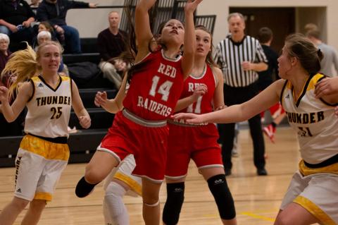 Eve Zephier drives in to add 2 points. Photos by Barb Pechous