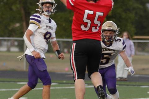 Bennett Kuhlman goes up to block the pass attempt.