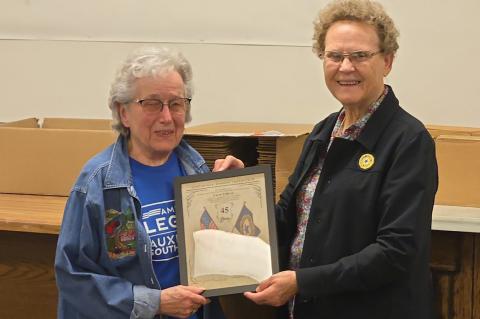 Carol Tolliver receiving her award for 45 years of continuous membership presented by Membership Chairman Barbara Kucera.