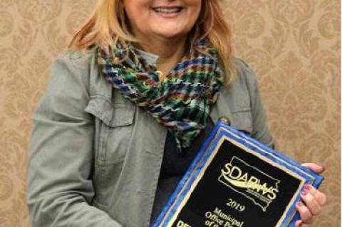 Debbra Houseman, Finance Officer for the City of Lake Andes is presented with the Municipal Office Manager of the Year award in Pierre January 16, 2020.