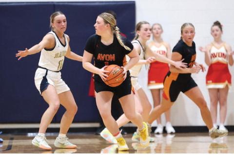 Jordyn Voigt looks to pass to an open teammate during recent region play in Gayville.