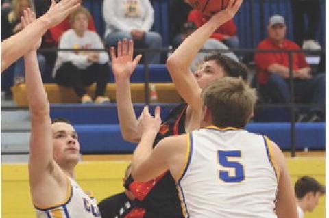 Zander Fathke drives the lane for 2 points. Special thanks to Karla Bovill Photos.