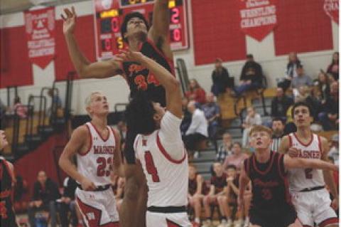 Al'Shamon Gunter goes up for the 2-point shot as Cale Cooper sets up to rebound.
