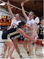 Alexis Vanderlei and Kaydence Metzger set up defensively, looking to disrupt the pass. Photos by Barb Pechous